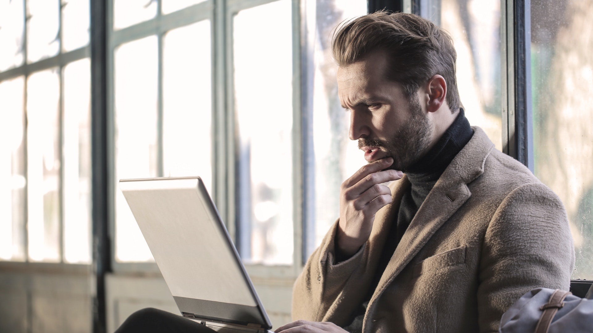 A venue owner reviewing an enquiry on a laptop